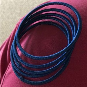 Set of 5 dark blue bracelets.